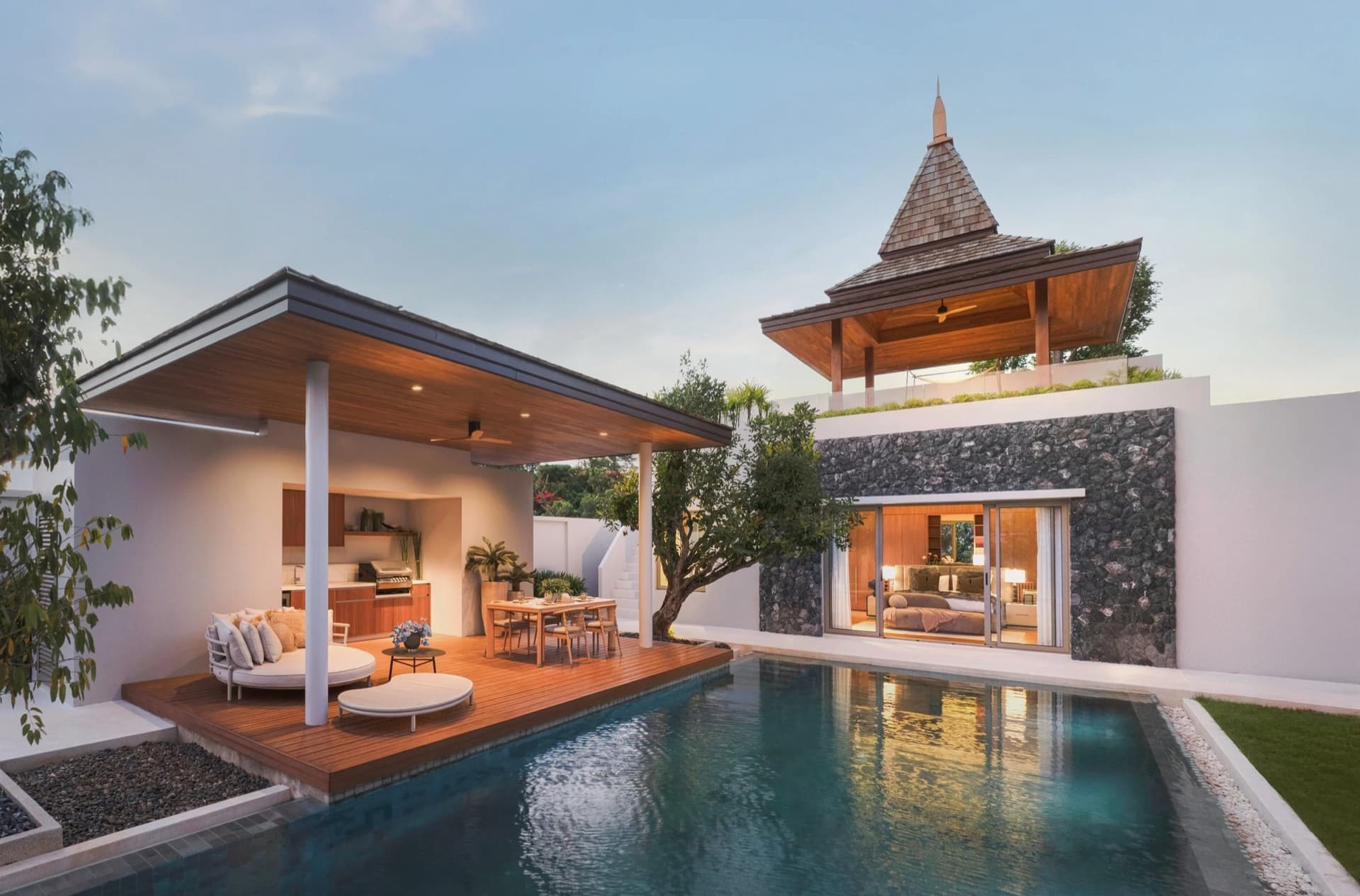 Botanica Four Seasons โ outdoor terrace with pool view and dining area