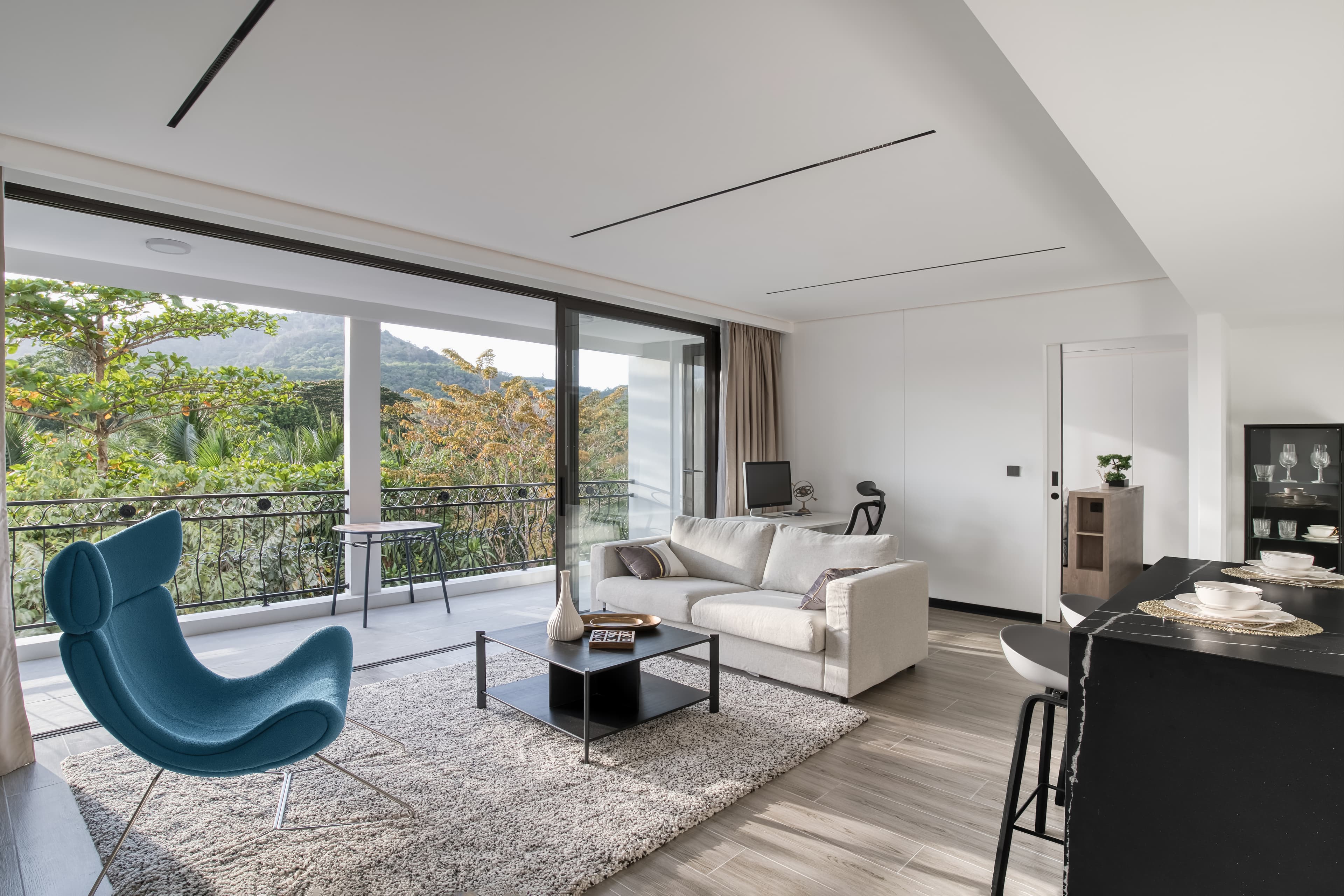 Essence Residences living room โ contemporary tropical interior